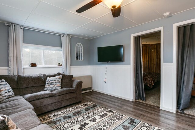 77 Pine Creek Village Rd, Gaines, PA 16921 - living room with ceiling fan, wainscoting, and dark wood-type flooring