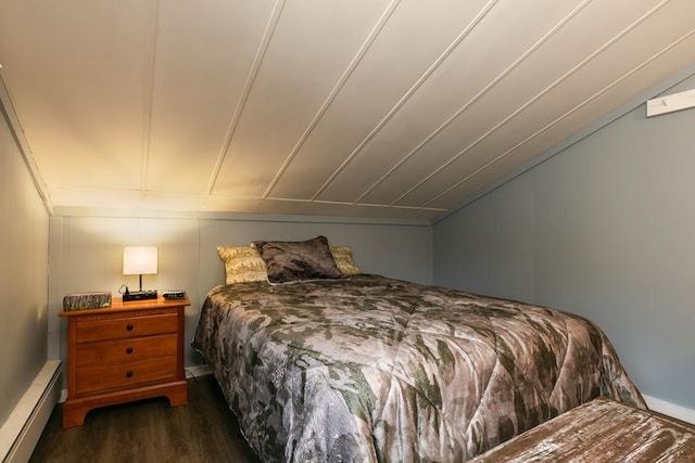 77 Pine Creek Village Rd, Gaines, PA 16921 - bedroom with dark wood-style flooring, a decorative wall, and a baseboard heating unit