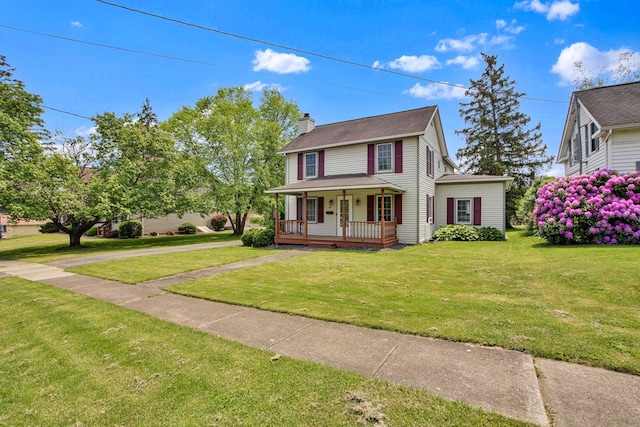 67 W Ave, Wellsboro, PA 16901 - view of front of house with covered porch, a chimney, and a front lawn