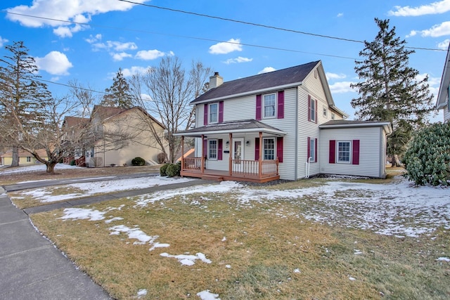 view of front facade featuring a yard and a porch