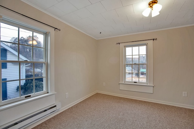 unfurnished room with baseboard heating, carpet flooring, and crown molding