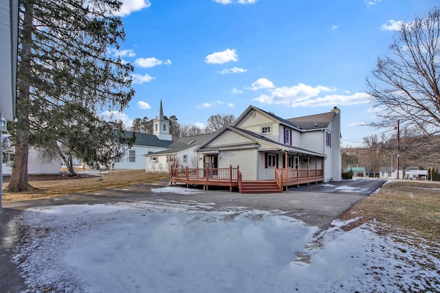 view of front of property with a wooden deck