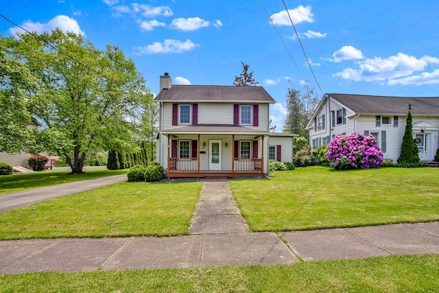 67 W Ave, Wellsboro, PA 16901 - view of front of house featuring a porch, a chimney, and a front yard
