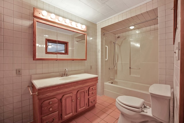 full bathroom featuring tub / shower combination, tile patterned flooring, ornamental molding, tile walls, and vanity