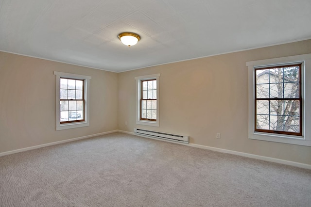 unfurnished room featuring baseboard heating and light colored carpet