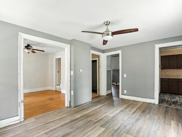 536 Fulton St, Waverly, NY 14892 - unfurnished bedroom featuring light wood-type flooring, ceiling fan, and ensuite bathroom