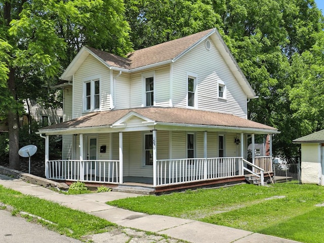 536 Fulton St, Waverly, NY 14892 - farmhouse inspired home with a porch, a front lawn, and roof with shingles