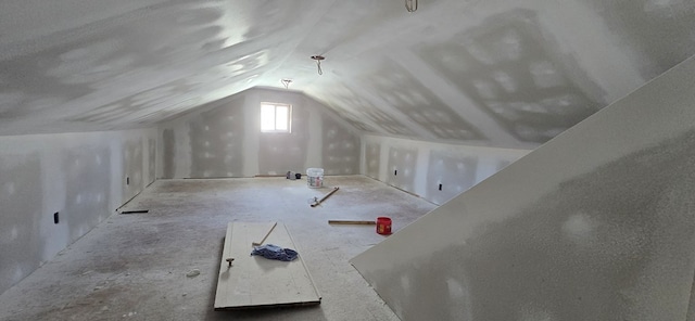 additional living space with vaulted ceiling