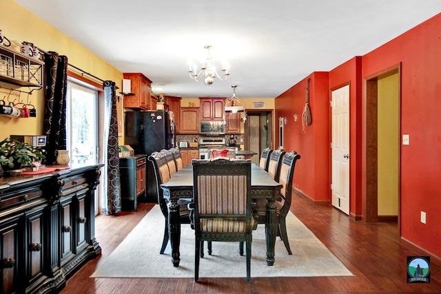 dining room featuring a chandelier and hardwood / wood-style flooring