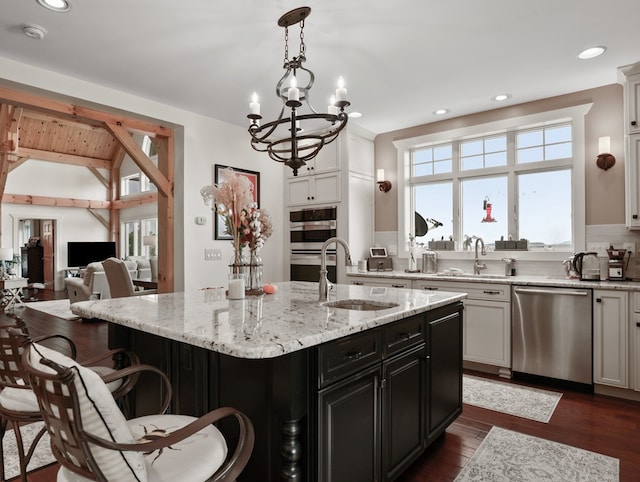 4535 Covered Bridge Rd, Ulster, PA 18850 - kitchen with stainless steel appliances, a sink, healthy amount of natural light, an island with sink, and recessed lighting