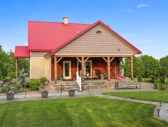 4535 Covered Bridge Rd, Ulster, PA 18850 - rear view of house with a chimney, a yard, a patio, and metal roof