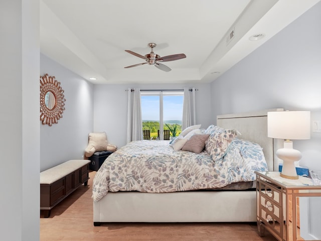 4535 Covered Bridge Rd, Ulster, PA 18850 - bedroom with a raised ceiling, light wood-style flooring, a ceiling fan, and recessed lighting
