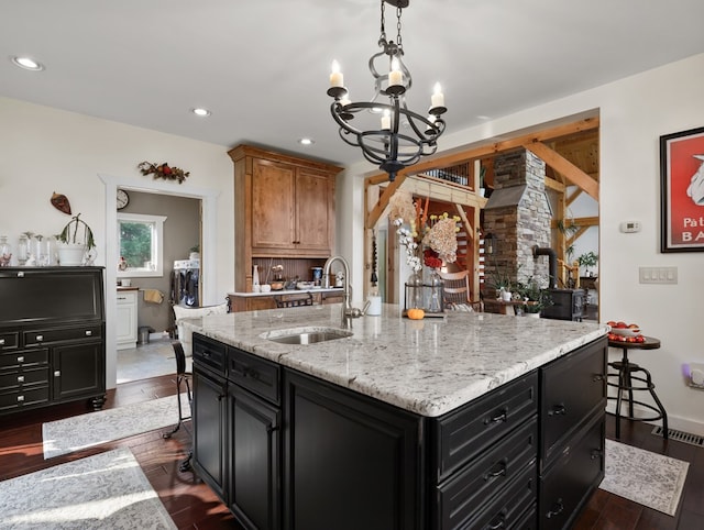 4535 Covered Bridge Rd, Ulster, PA 18850 - kitchen with a sink, dark cabinetry, a chandelier, recessed lighting, and dark wood-style floors