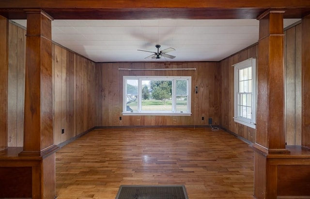 unfurnished room with hardwood / wood-style flooring, ceiling fan, and plenty of natural light