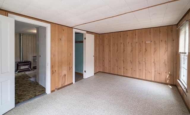 unfurnished bedroom featuring wood walls