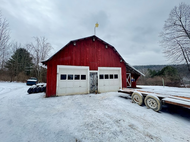 view of snow covered garage