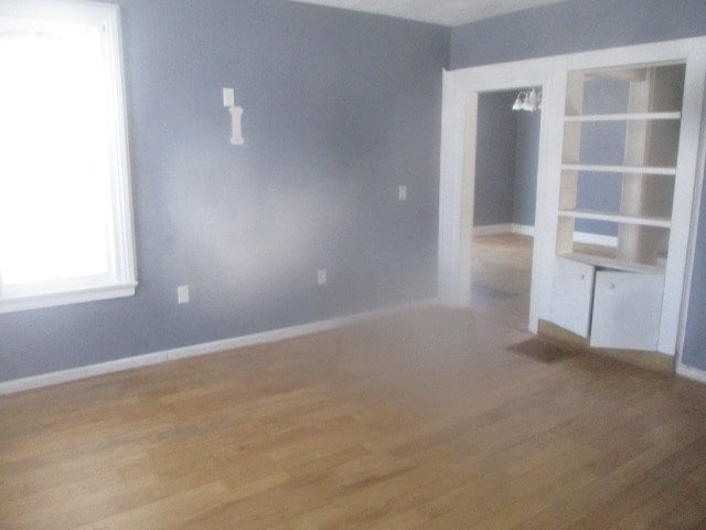 spare room featuring light wood-type flooring