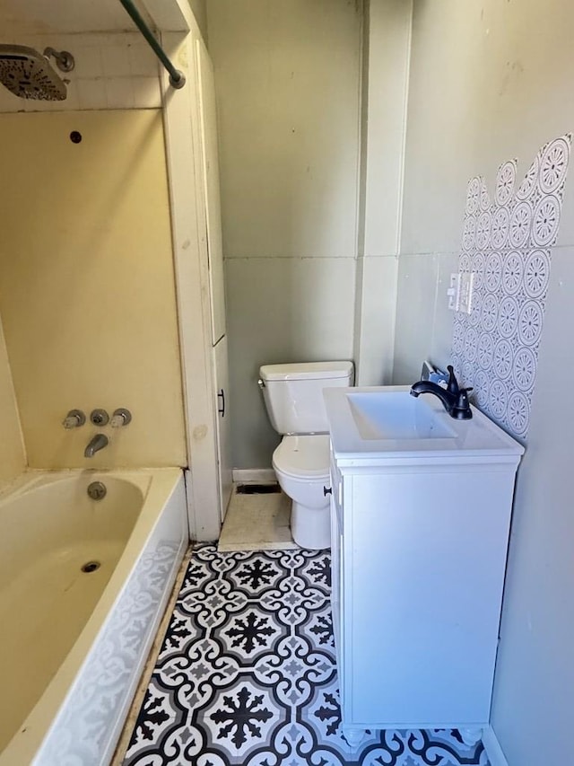 full bathroom with tile patterned flooring, vanity, toilet, and washtub / shower combination