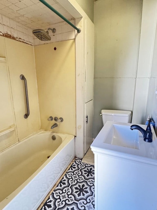 full bathroom featuring tile patterned flooring, vanity, bathtub / shower combination, and toilet