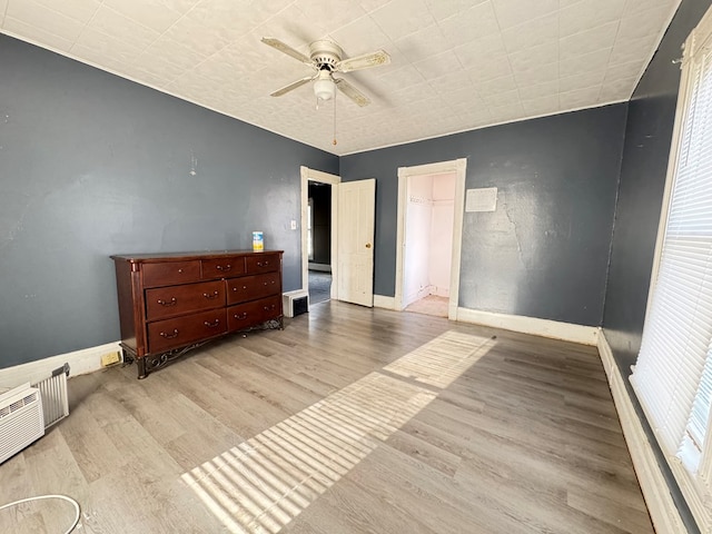 bedroom with ceiling fan and light hardwood / wood-style floors