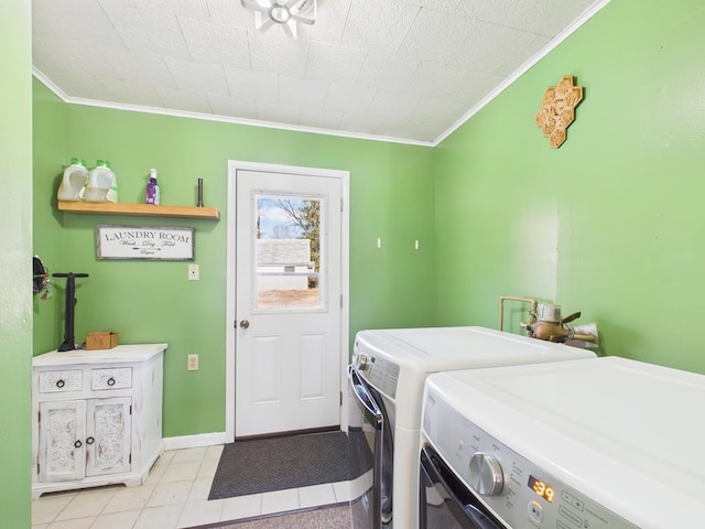 clothes washing area featuring laundry area, crown molding, baseboards, and washer and clothes dryer