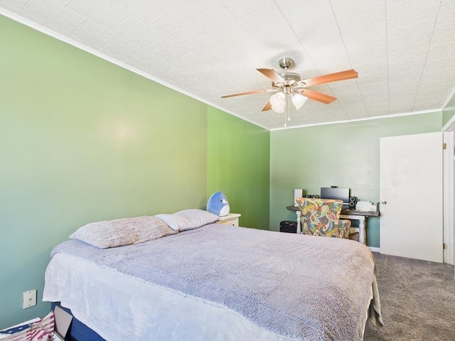 carpeted bedroom with ceiling fan and crown molding