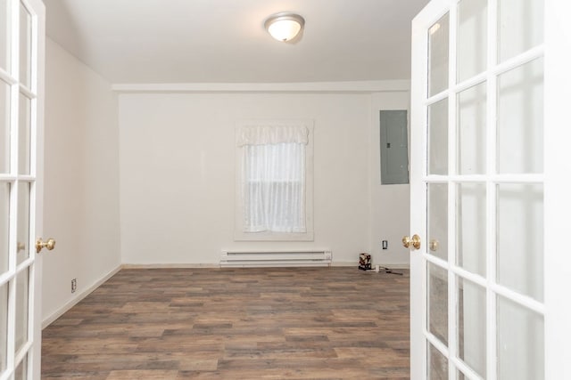 unfurnished room featuring french doors, electric panel, baseboard heating, and dark wood-type flooring