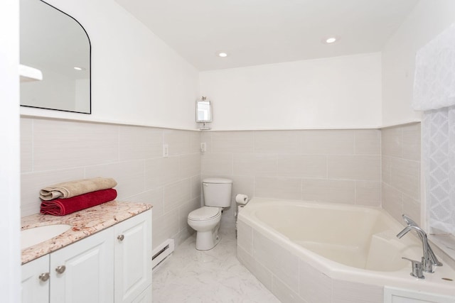 bathroom with vanity, toilet, baseboard heating, tile walls, and tiled bath