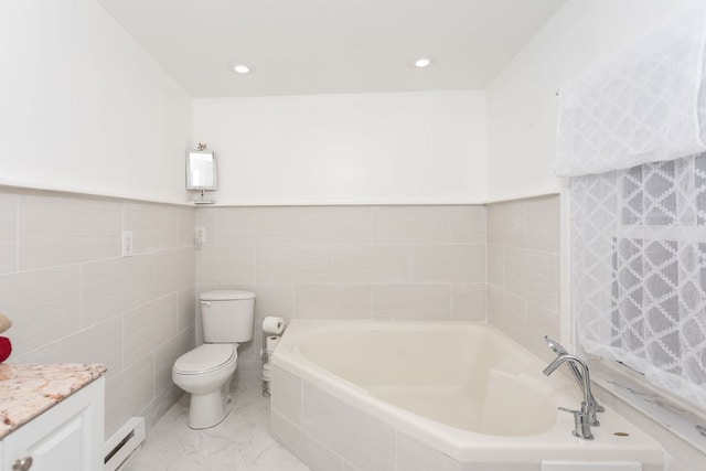 bathroom with vanity, toilet, tile walls, a baseboard radiator, and tiled bath