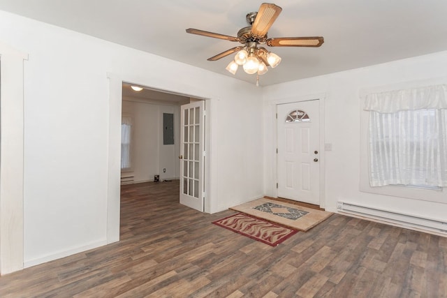 entryway with dark hardwood / wood-style flooring, electric panel, ceiling fan, and a baseboard heating unit