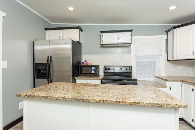 kitchen featuring white cabinetry, a kitchen island, black appliances, and light tile patterned floors