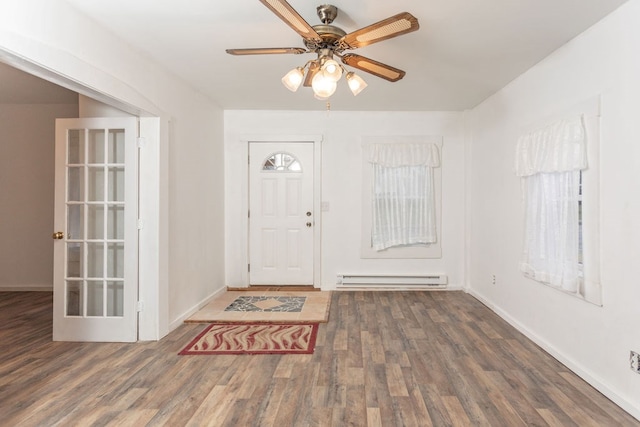 entryway featuring baseboard heating, ceiling fan, and dark hardwood / wood-style flooring