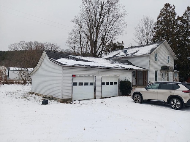 38699 Rte 187, Rome, PA 18837 - view of snow covered exterior featuring a garage
