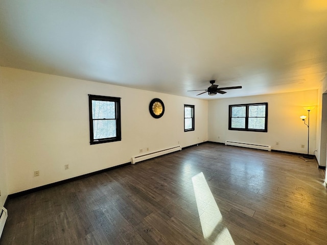 empty room featuring ceiling fan, a baseboard radiator, and dark hardwood / wood-style flooring