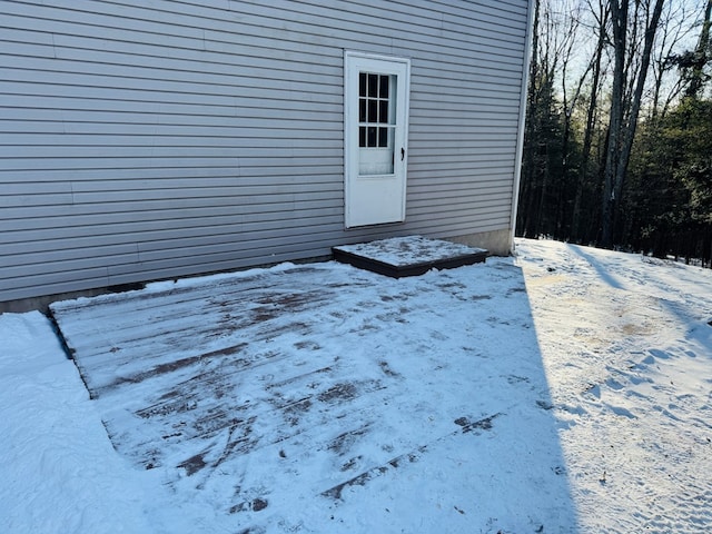 view of snow covered property entrance