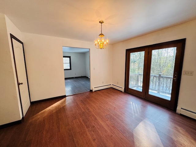 unfurnished room featuring a chandelier, baseboard heating, and dark wood-type flooring