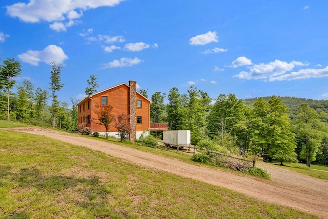 5284-A Rte 6 W, Ulysses, PA 16948 - view of side of home with dirt driveway, a chimney, and a yard