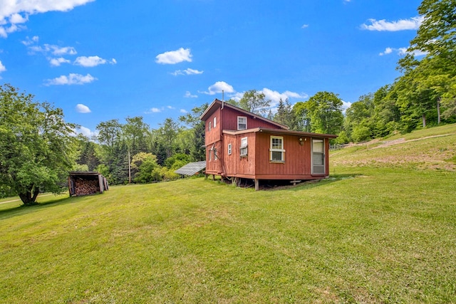 5284-A Rte 6 W, Ulysses, PA 16948 - view of home's exterior featuring a lawn, a forest view, and an outdoor structure