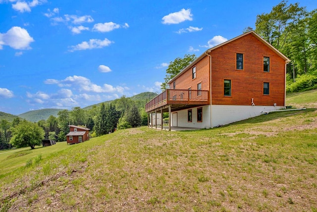 5284-A Rte 6 W, Ulysses, PA 16948 - rear view of property featuring a yard, a deck with mountain view, and a patio area