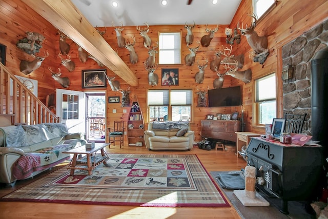 5284-A Rte 6 W, Ulysses, PA 16948 - living area featuring wood finished floors, stairway, wooden walls, a wood stove, and recessed lighting