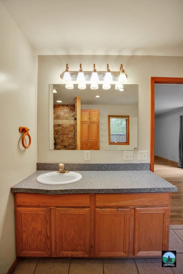 bathroom featuring tile patterned flooring and vanity