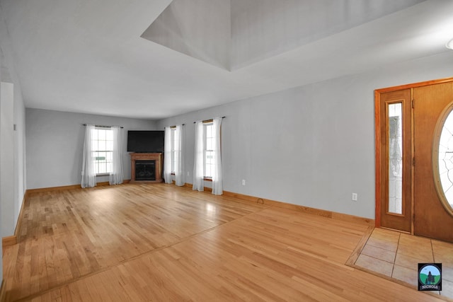 unfurnished living room with light hardwood / wood-style flooring