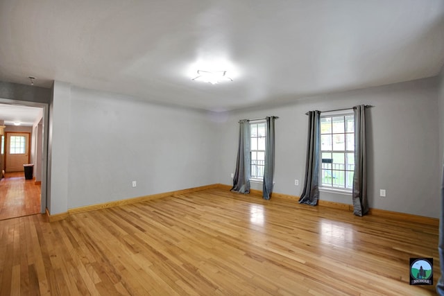 spare room featuring light hardwood / wood-style flooring