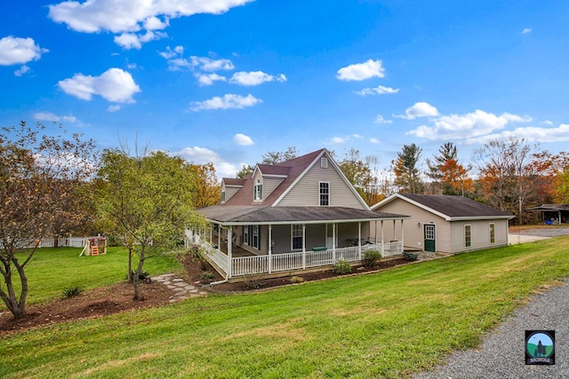 view of front of home featuring a playground, covered porch, and a front yard