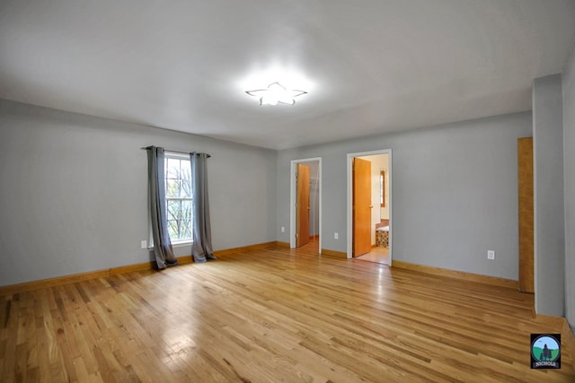 spare room featuring light hardwood / wood-style floors