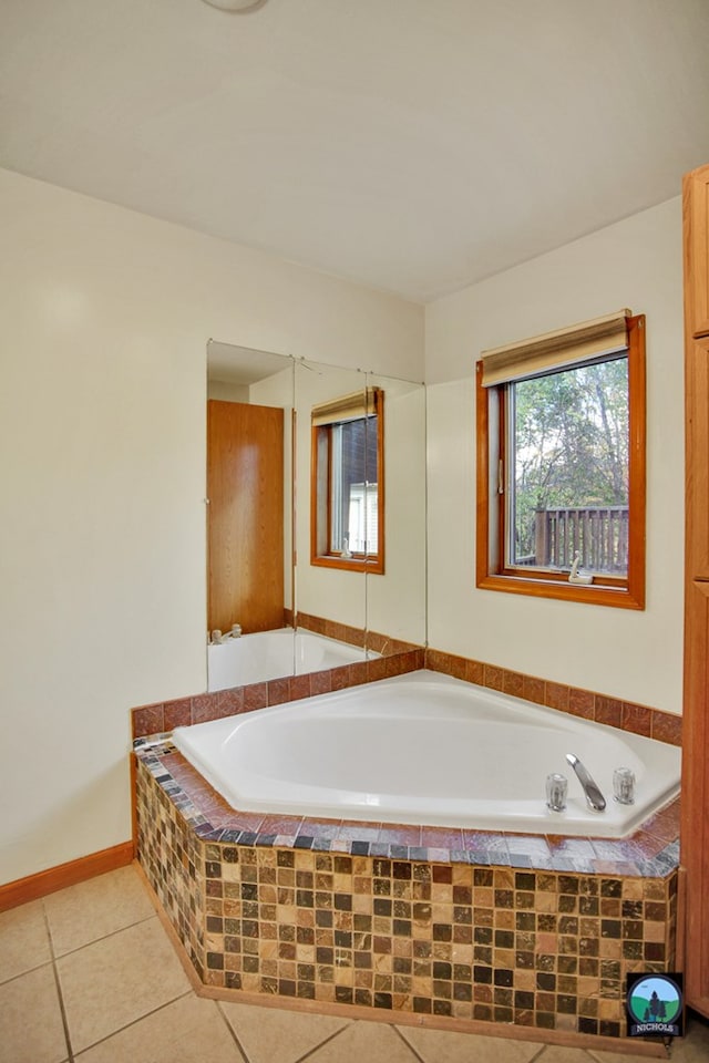 bathroom featuring tiled bath and tile patterned floors