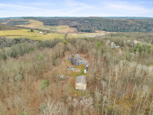 birds eye view of property with a rural view