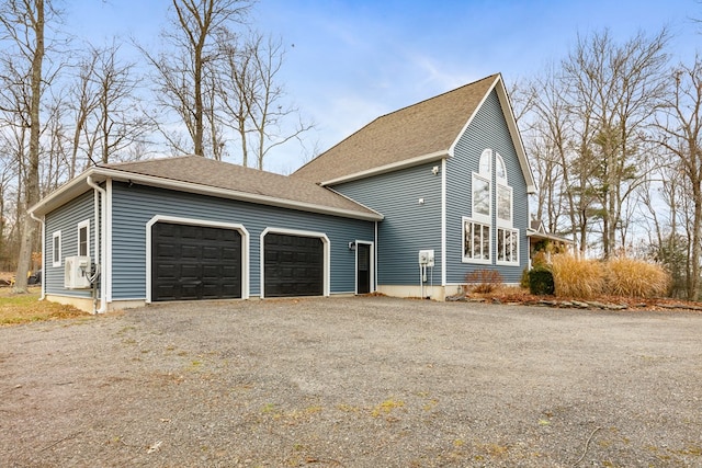 view of side of property featuring a garage