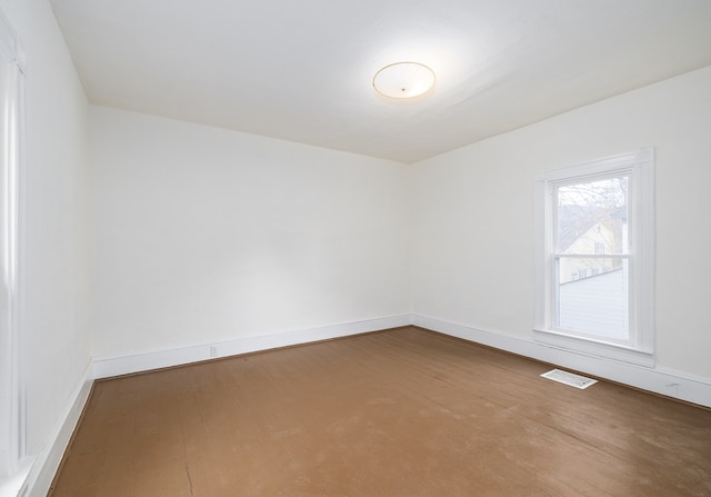 spare room with hardwood / wood-style flooring