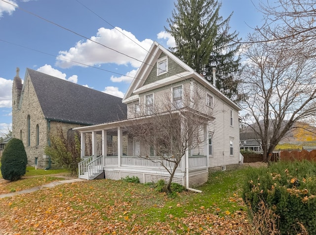 exterior space with a lawn and covered porch